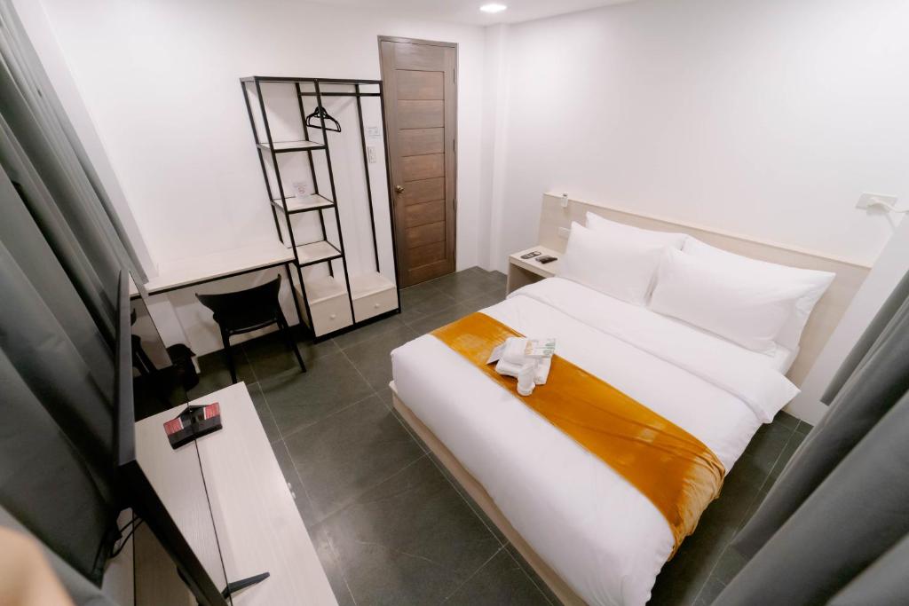 Postel nebo postele na pokoji v ubytování A Traveller's Inn
