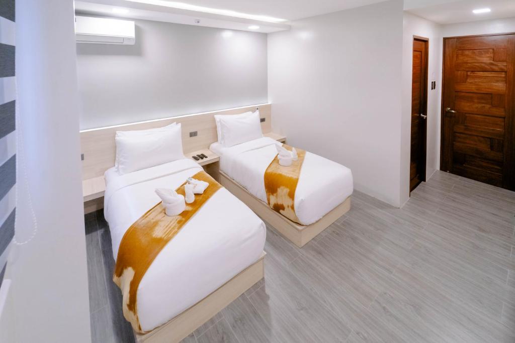 Postel nebo postele na pokoji v ubytování A Traveller's Inn