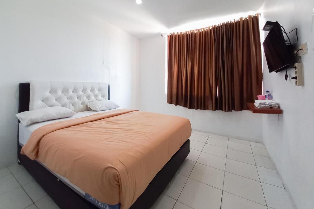 JOY GuestHouse Pekanbaru Mitra RedDoorz - Habitación Doble Deluxe