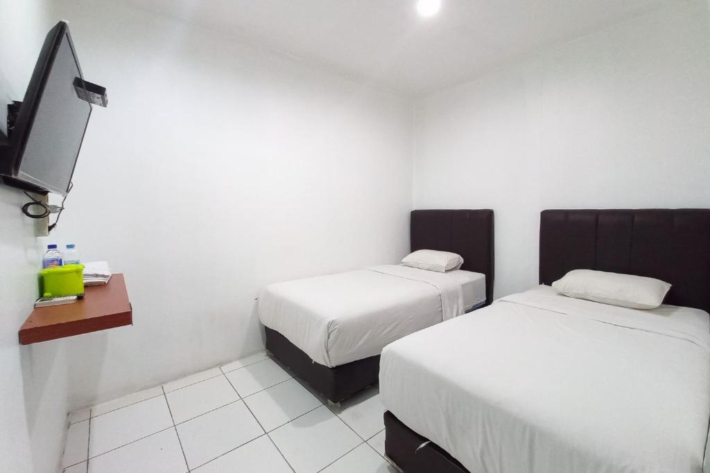 JOY GuestHouse Pekanbaru Mitra RedDoorz - Habitación Doble Deluxe