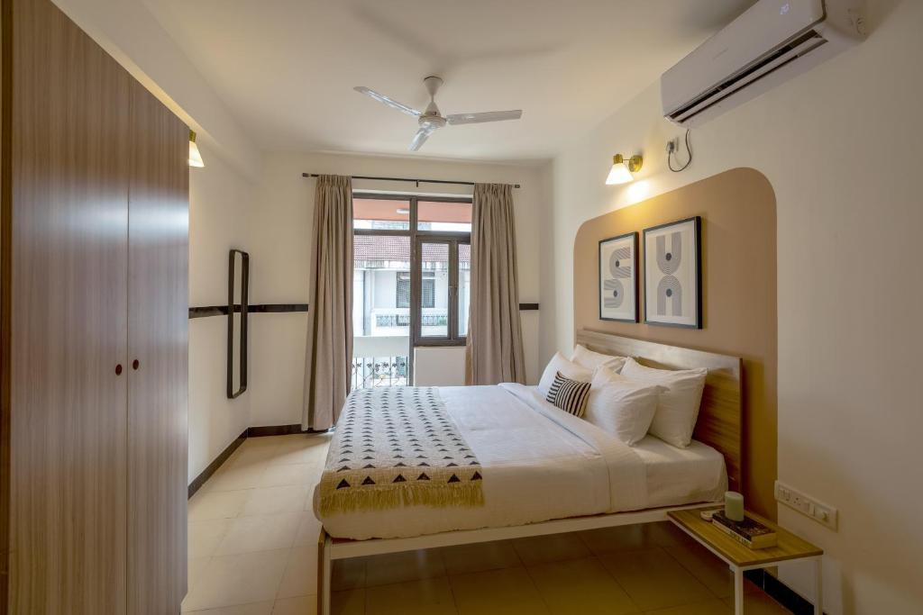 Postel nebo postele na pokoji v ubytování Olive Hotel Palace Road by Embassy Group