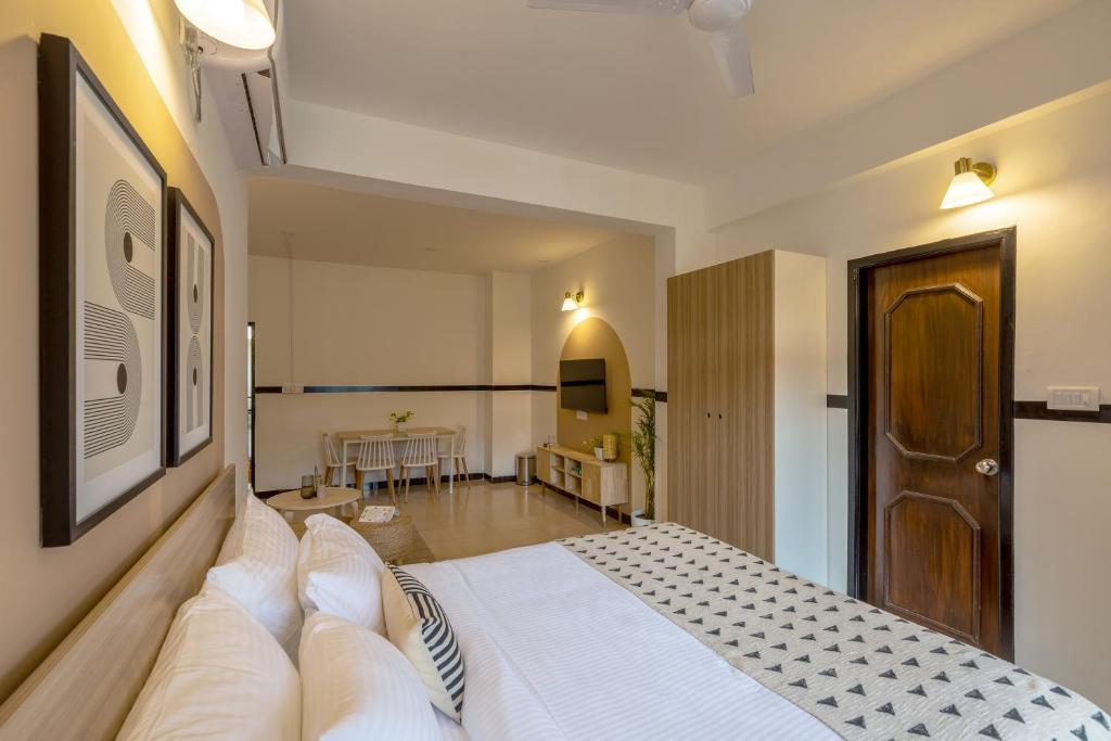Postel nebo postele na pokoji v ubytování Olive Hotel Palace Road by Embassy Group