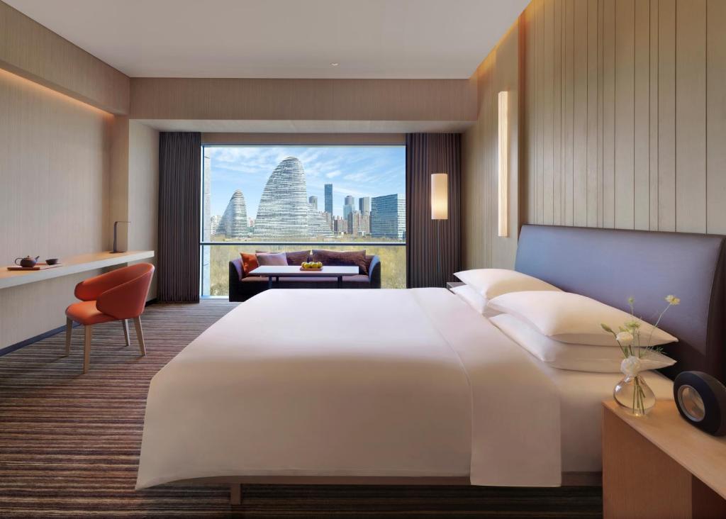 Postel nebo postele na pokoji v ubytování Hyatt Regency Beijing Wangjing