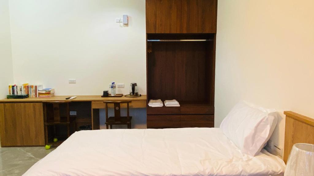 Voodi või voodid majutusasutuse Fu Yu B&B toas