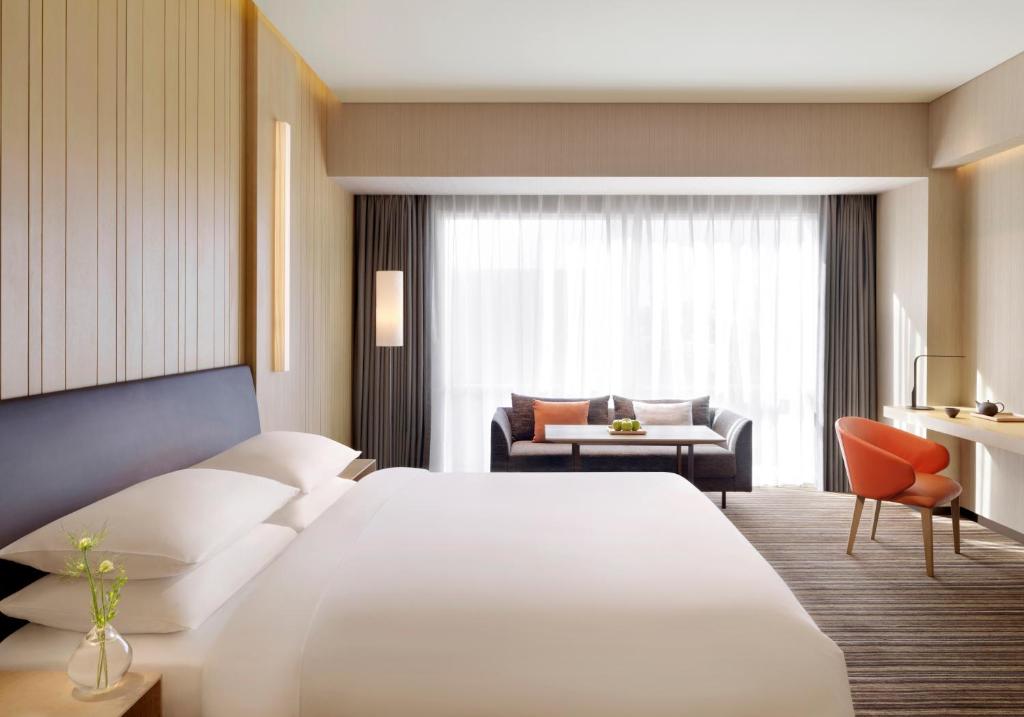 Postel nebo postele na pokoji v ubytování Hyatt Regency Beijing Wangjing