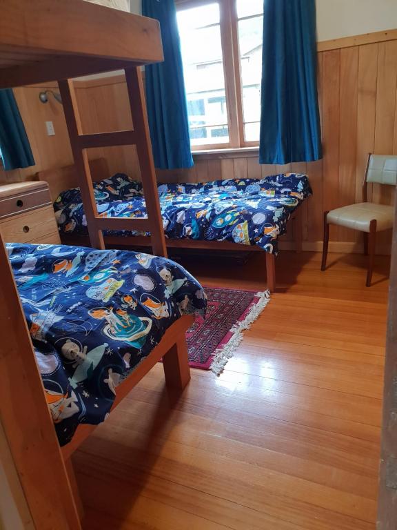 Postel nebo postele na pokoji v ubytování Blue Cottage