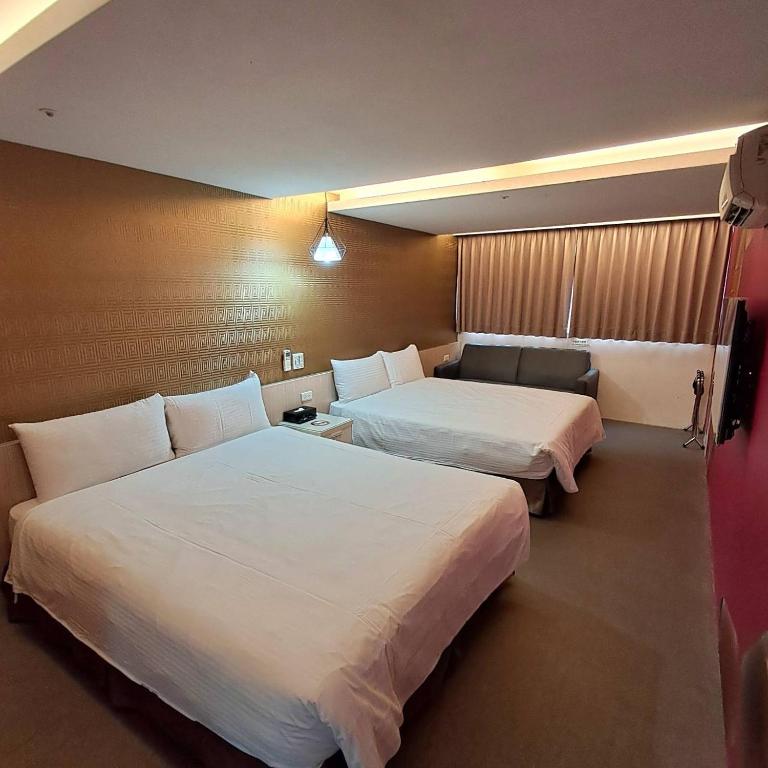 Voodi või voodid majutusasutuse Morwing Hotel Fuzhong toas