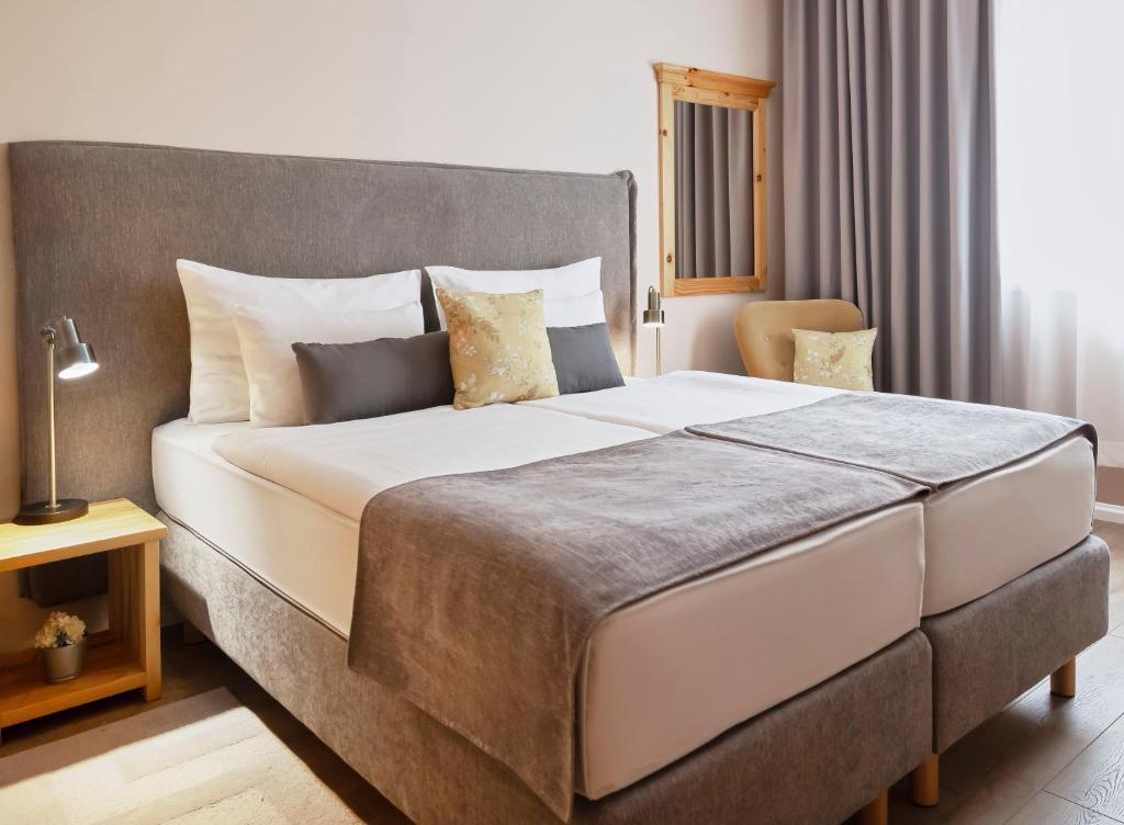 Postel nebo postele na pokoji v ubytování Hotel Kadoor