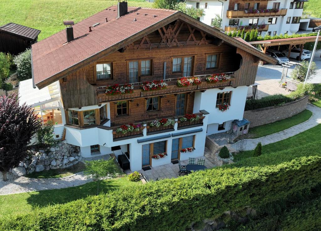 an aerial view of a house with flowers at Am Mühlrain in Sankt Anton am Arlberg