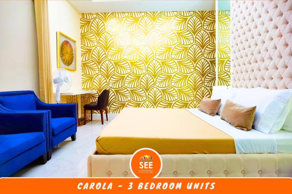 a bedroom with a bed and a yellow and white wall at PICO DE LORO Pool Accessible CAROLA 3 Bedroom Units by SEE Condominiums in Cutad
