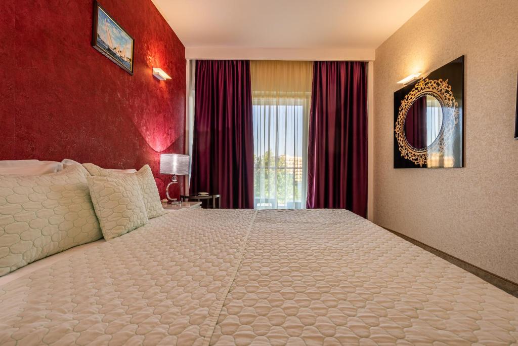 Postel nebo postele na pokoji v ubytování Alcor Beach Hotel