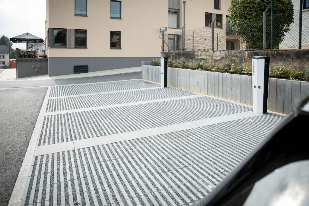 a metal gate in front of a building at La Différence in Vichten