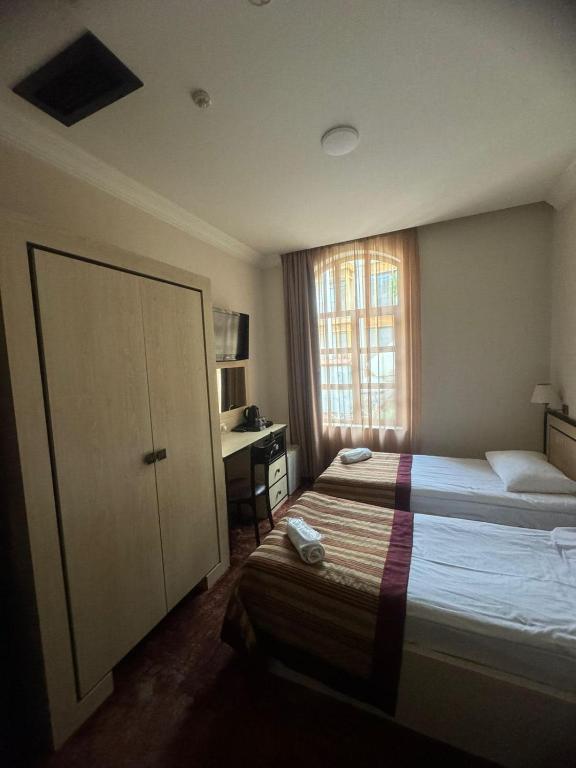 Postel nebo postele na pokoji v ubytování Hotel Beka Palace