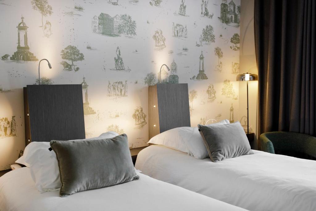 Postel nebo postele na pokoji v ubytování Best Western Plus Hôtel Gergovie