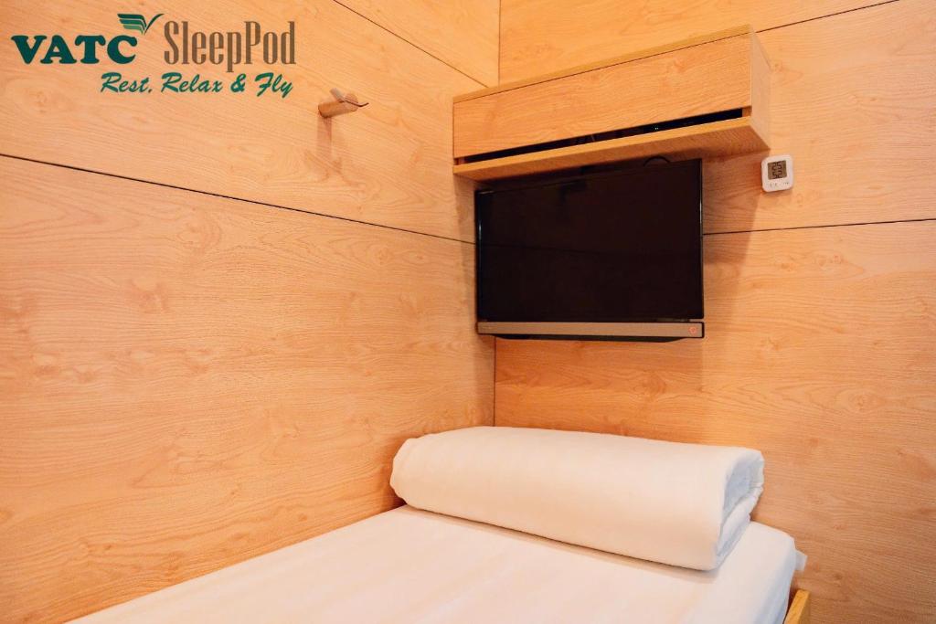 Postel nebo postele na pokoji v ubytování VATC Sleep Pod Terminal 1
