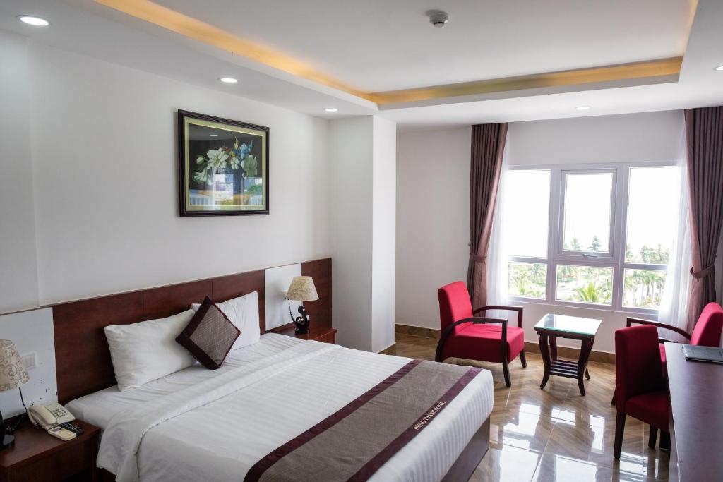 Giường trong phòng chung tại Gem Nha Trang Hotel