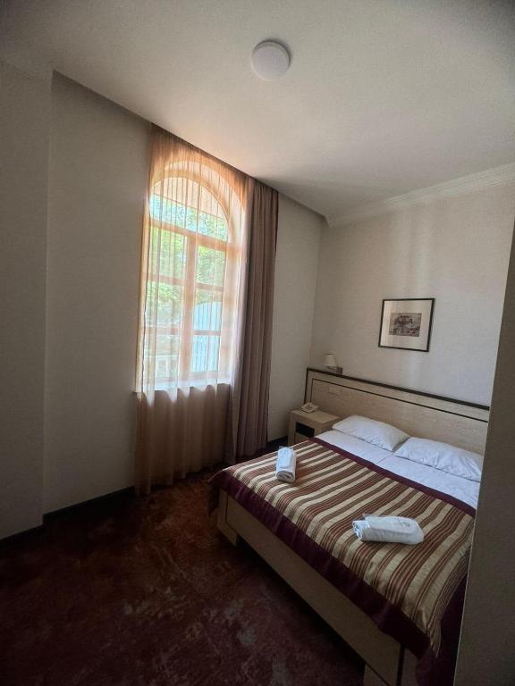 Postel nebo postele na pokoji v ubytování Hotel Beka Palace