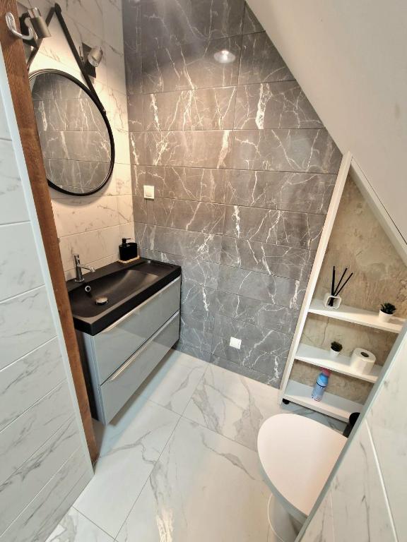 Kúpeľňa v ubytovaní Apartamenty Promyk Wisełka