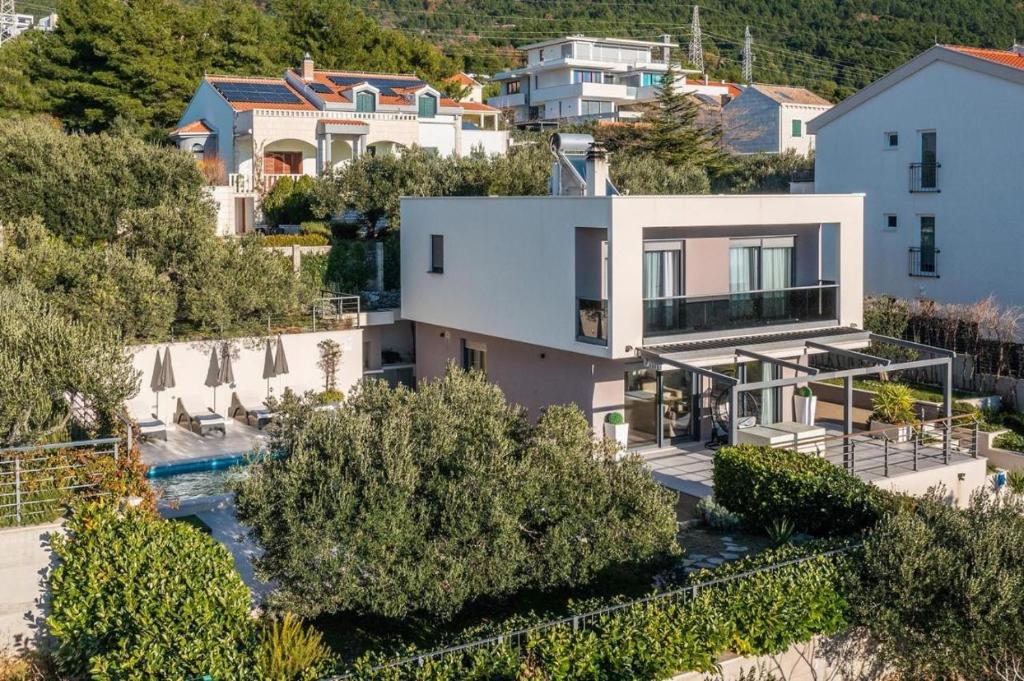 an aerial view of a house with a swimming pool at Villa Ribica in Veliko Brdo