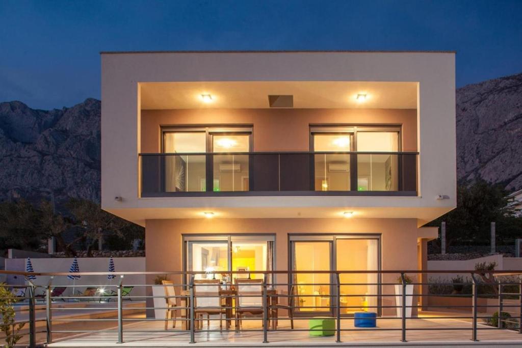 a house with a view of the mountains at Villa Ribica in Veliko Brdo