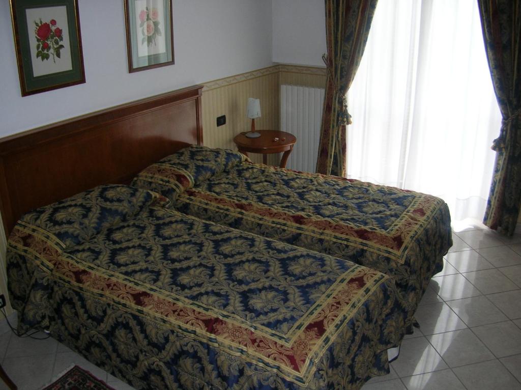 Postel nebo postele na pokoji v ubytování Hotel Belvedere