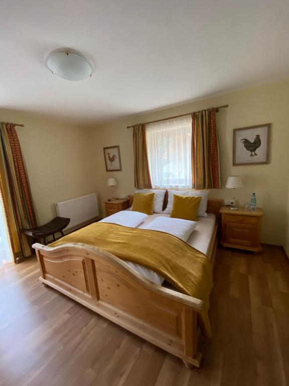 a bedroom with a large wooden bed in a room at Waldboden in San Leonardo in Passiria