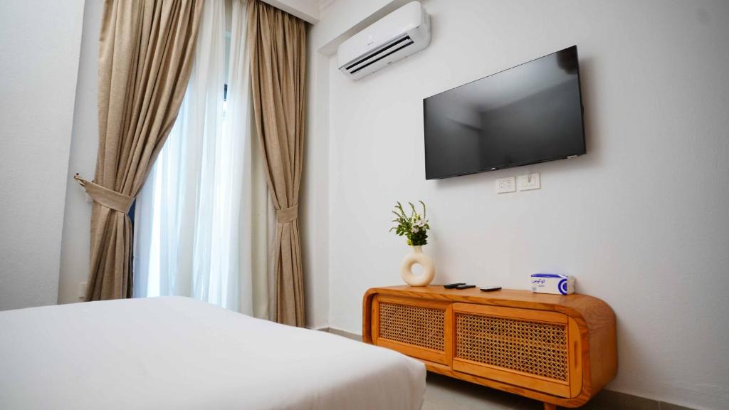 TV a/nebo společenská místnost v ubytování Ios Hotel & Village