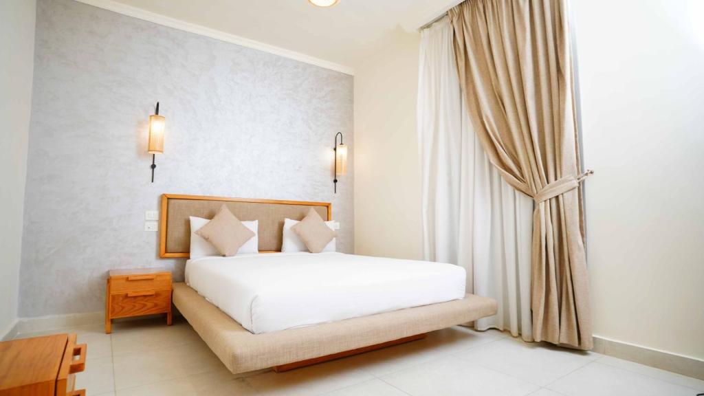 Postel nebo postele na pokoji v ubytování Ios Hotel & Village