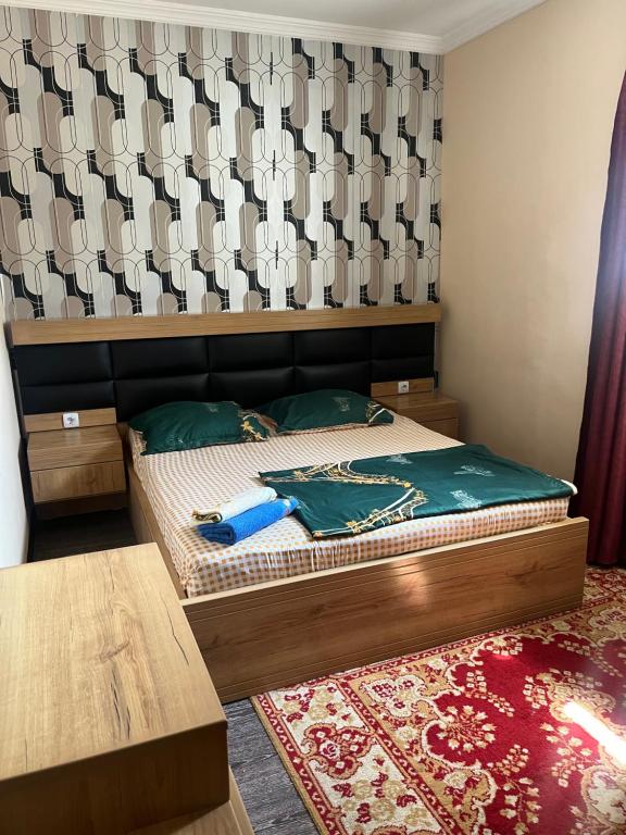 Postel nebo postele na pokoji v ubytování Guesthouse Dariali