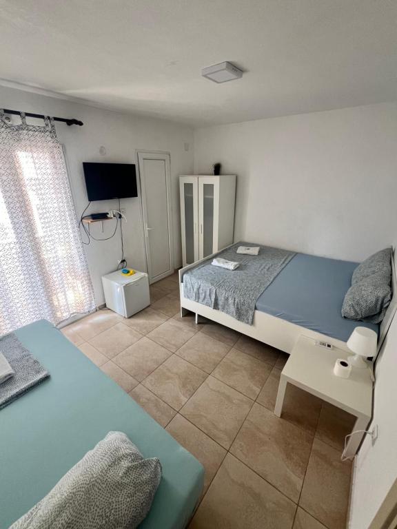Łóżko lub łóżka w pokoju w obiekcie IN Villa Guesthouse