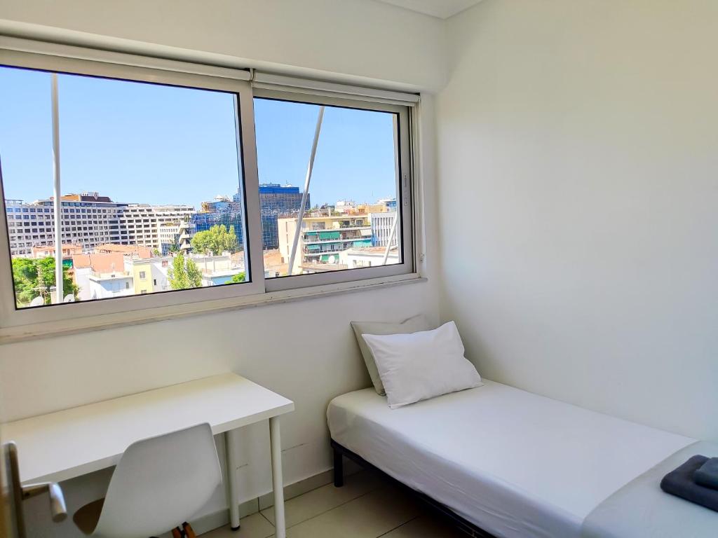 Posteľ alebo postele v izbe v ubytovaní KYMA Apartments - Athens Acropolis 15