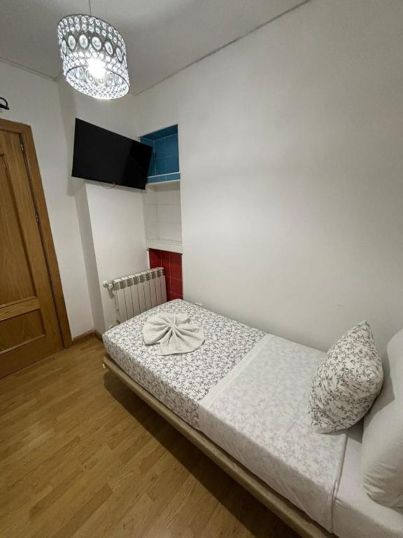 Cama o camas de una habitación en Hostal Flat55Madrid