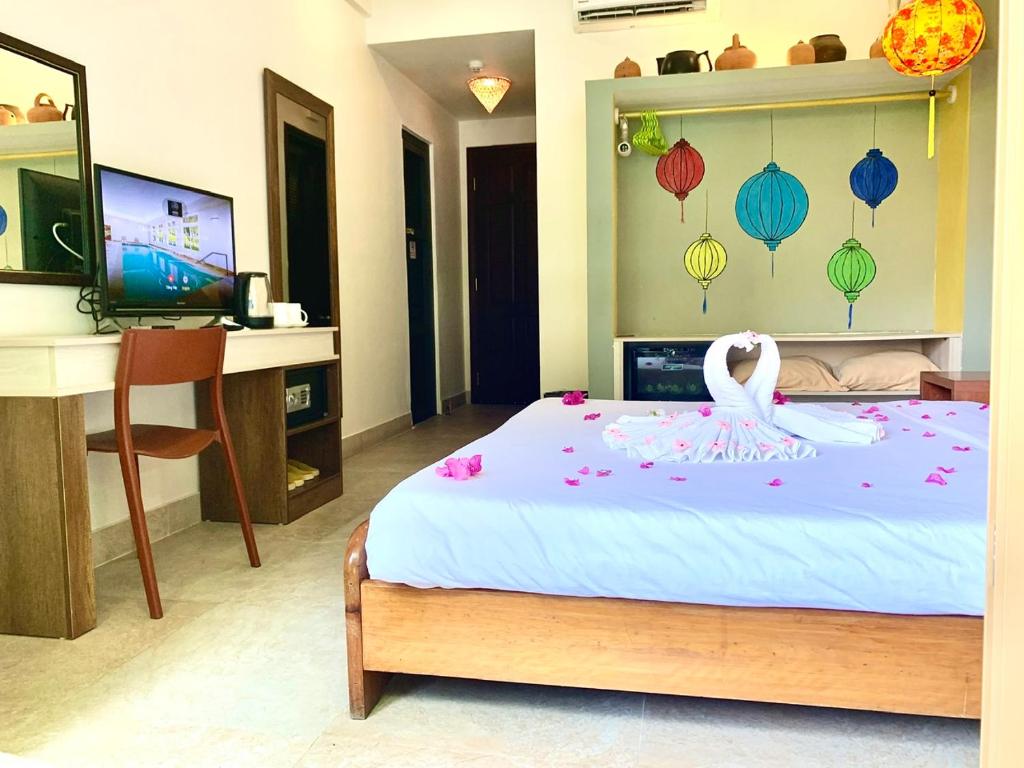Postel nebo postele na pokoji v ubytování De Vivre Hoi An Hotel