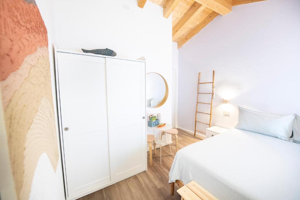 Postel nebo postele na pokoji v ubytování B&B La Volpe