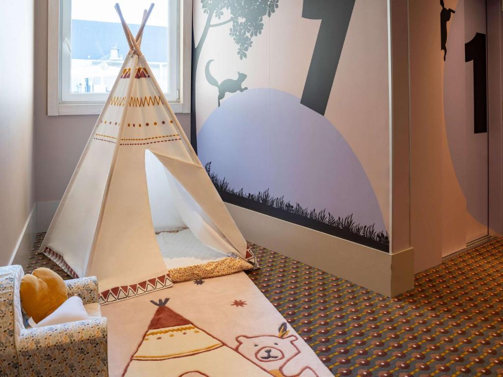 Postel nebo postele na pokoji v ubytování ibis Styles Guéret