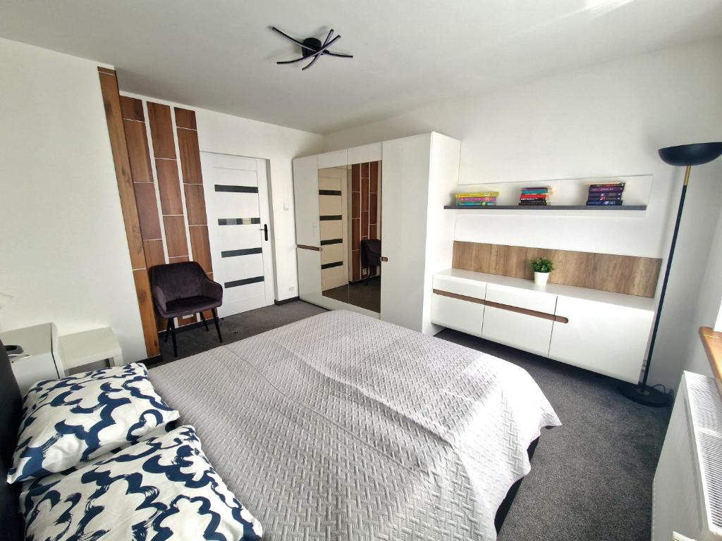 Posteľ alebo postele v izbe v ubytovaní Apartamenty Promyk Wisełka