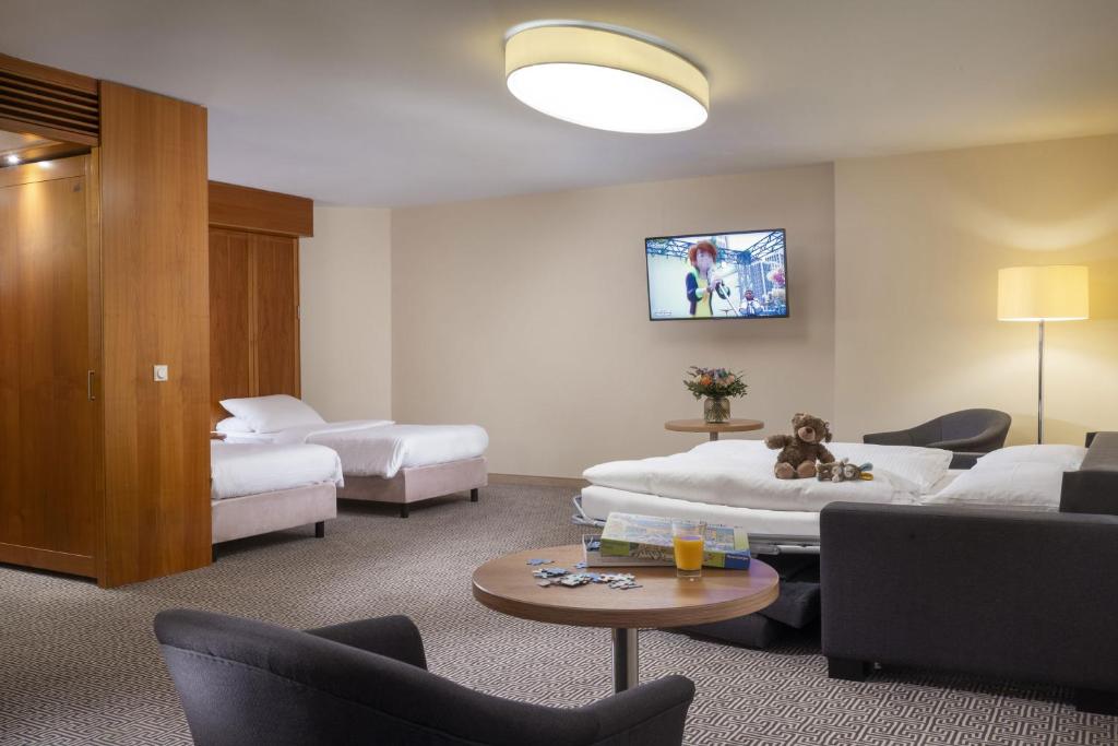 Postel nebo postele na pokoji v ubytování Maritim Hotel Stuttgart