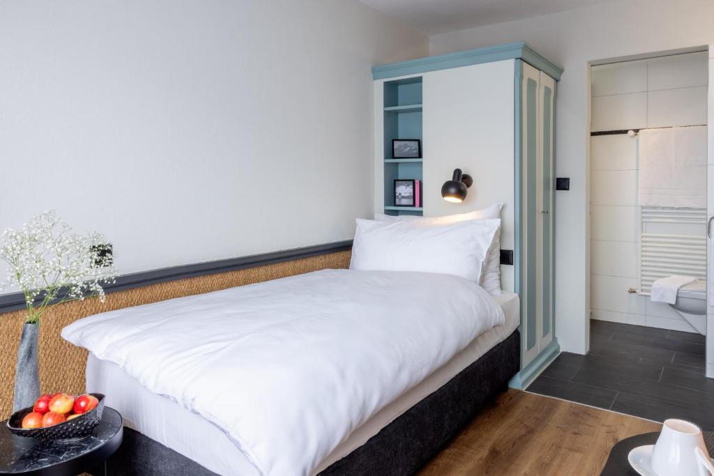 Postel nebo postele na pokoji v ubytování Hotel Luzernerhof