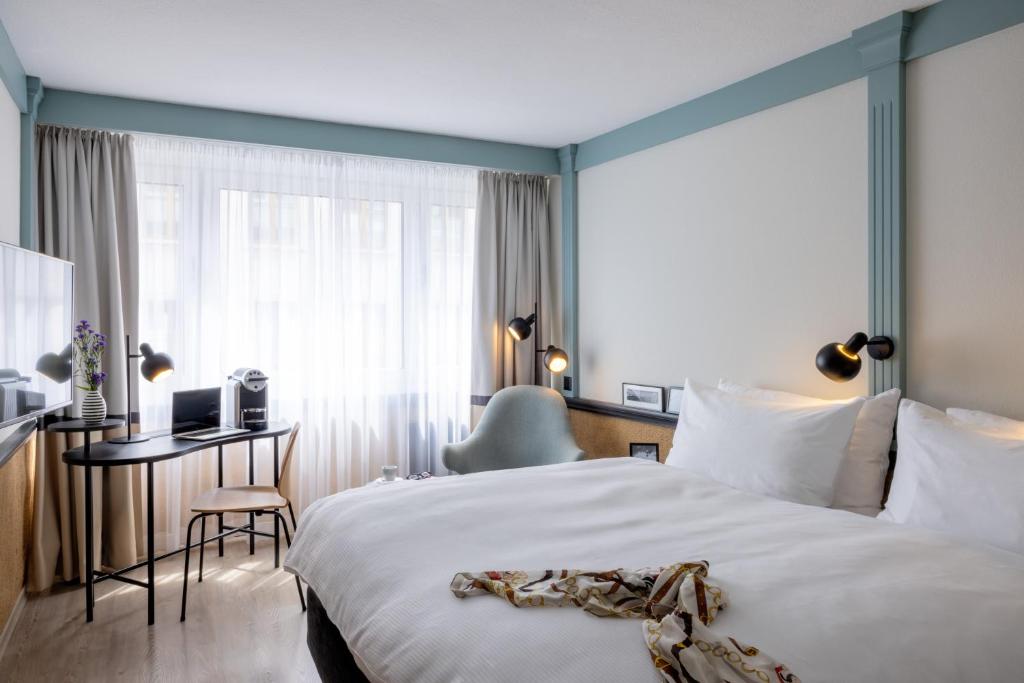 Postel nebo postele na pokoji v ubytování Hotel Luzernerhof