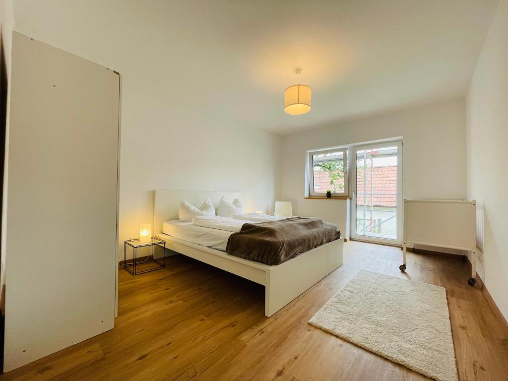 Postel nebo postele na pokoji v ubytování Dill Apartment Pleinfeld am Brombachsee I