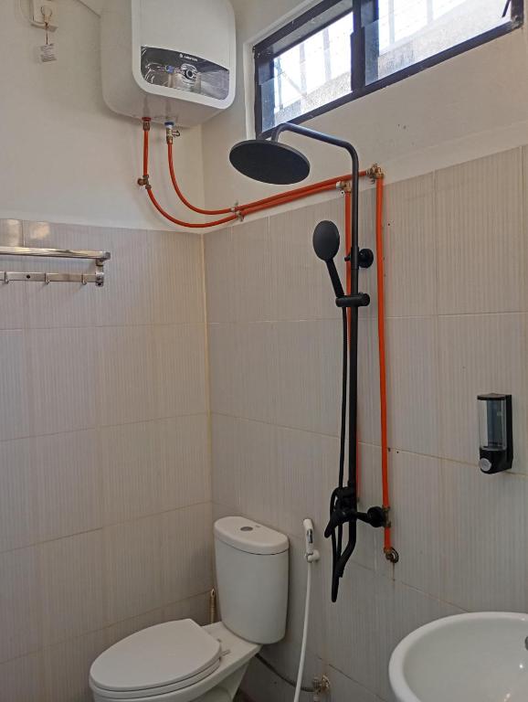 Koupelna v ubytování Hotel Bhakti Syariah