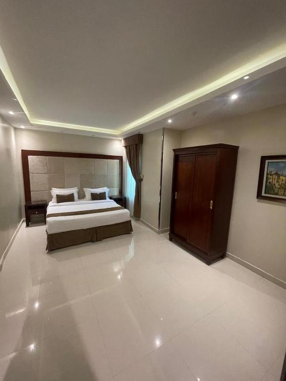 Postel nebo postele na pokoji v ubytování Al Muhaidb Residence for Chalets and Holidays Homes المهيدب ريزدنس لبيوت العطلات