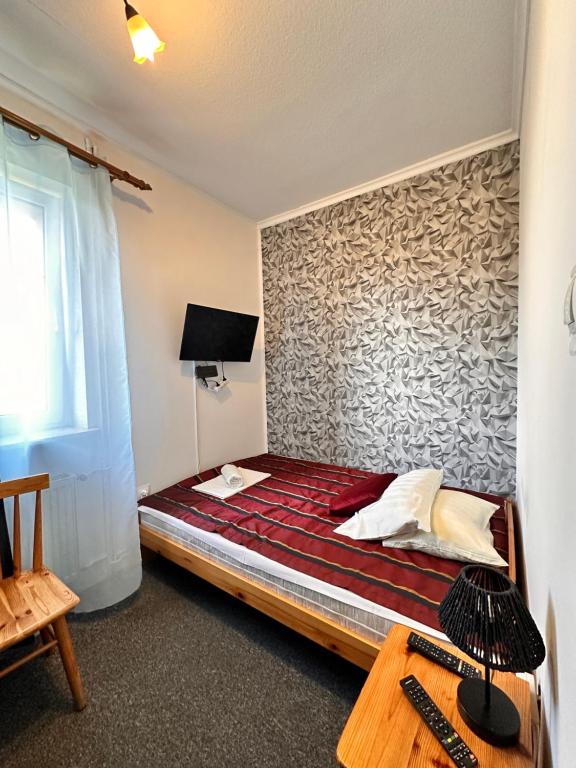 Postel nebo postele na pokoji v ubytování RETRO Noclegi
