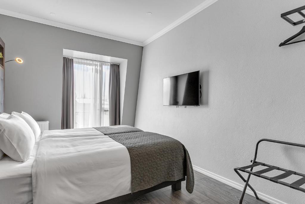 Postel nebo postele na pokoji v ubytování Hotel Aska