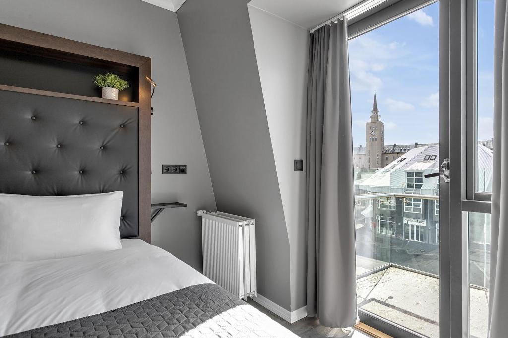 Postel nebo postele na pokoji v ubytování Hotel Aska
