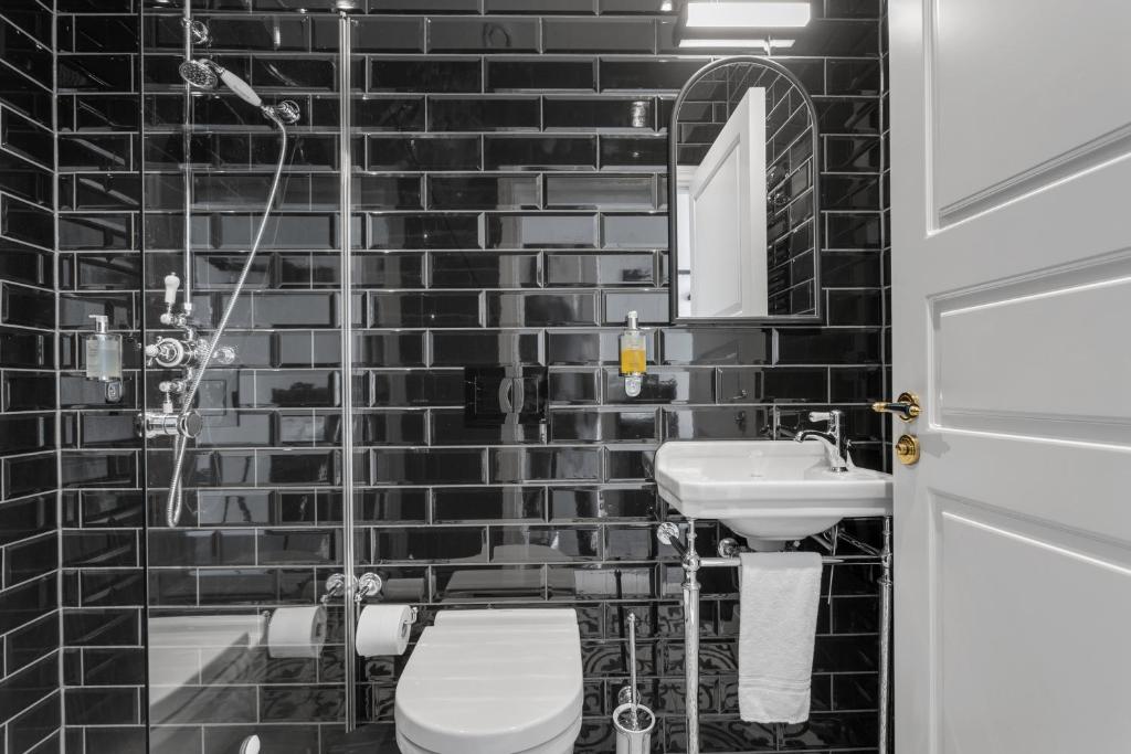 Koupelna v ubytování Hotel Aska