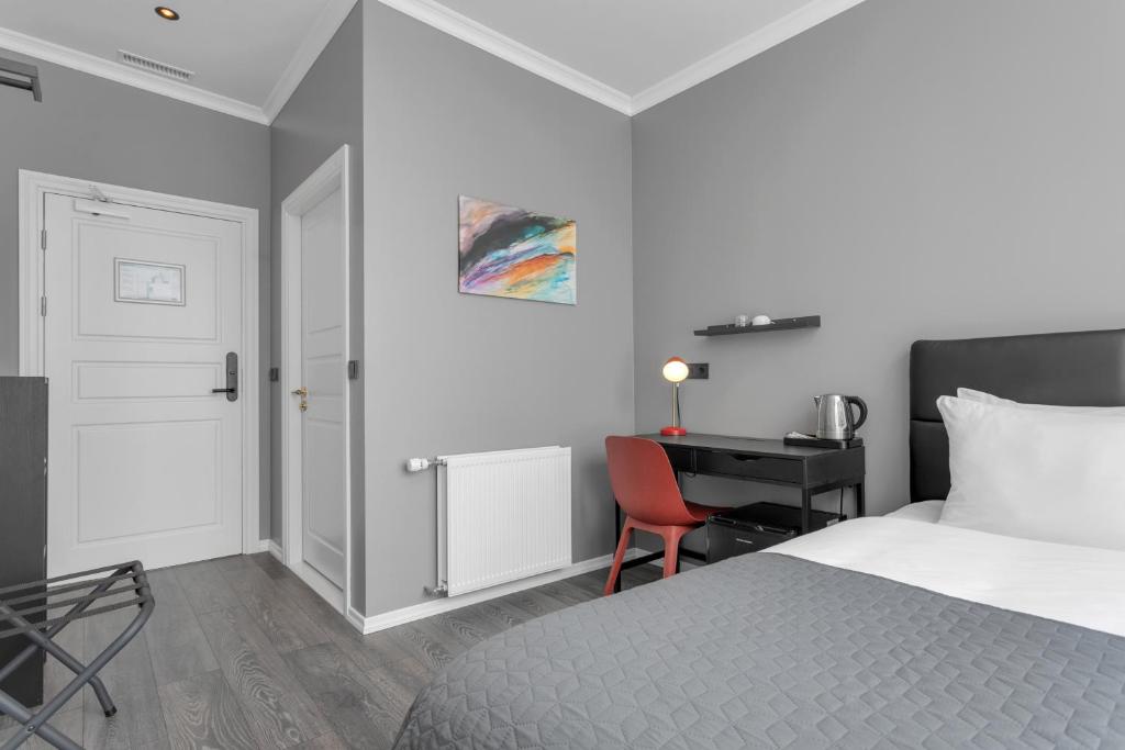 Postel nebo postele na pokoji v ubytování Hotel Aska
