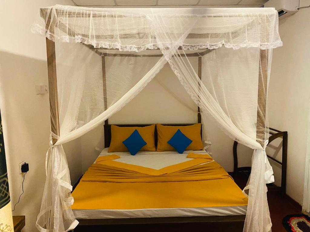 Postel nebo postele na pokoji v ubytování Perfect Home Mirissa