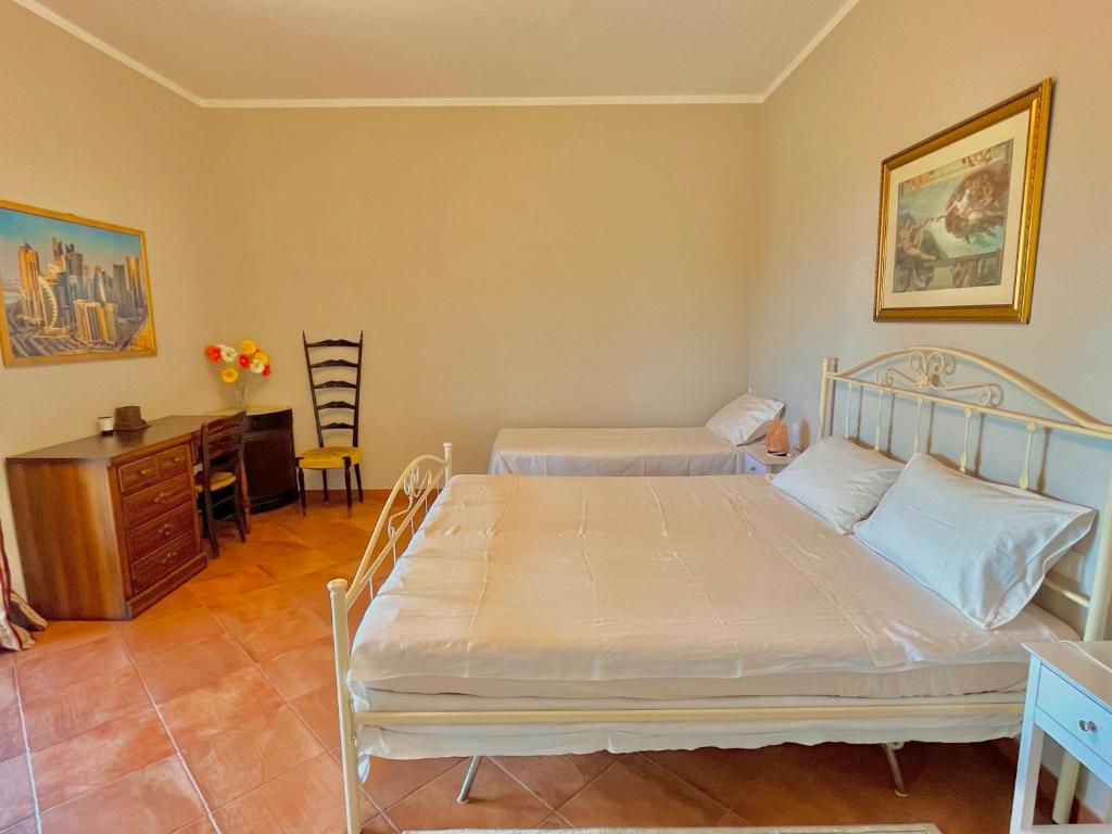 Postel nebo postele na pokoji v ubytování B&B Terre Toscane