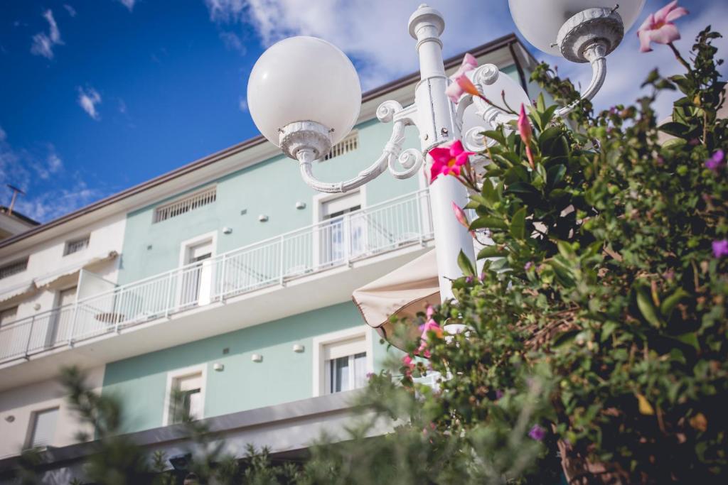 a street light in front of a building at Hotel Ronchi in Cervia
